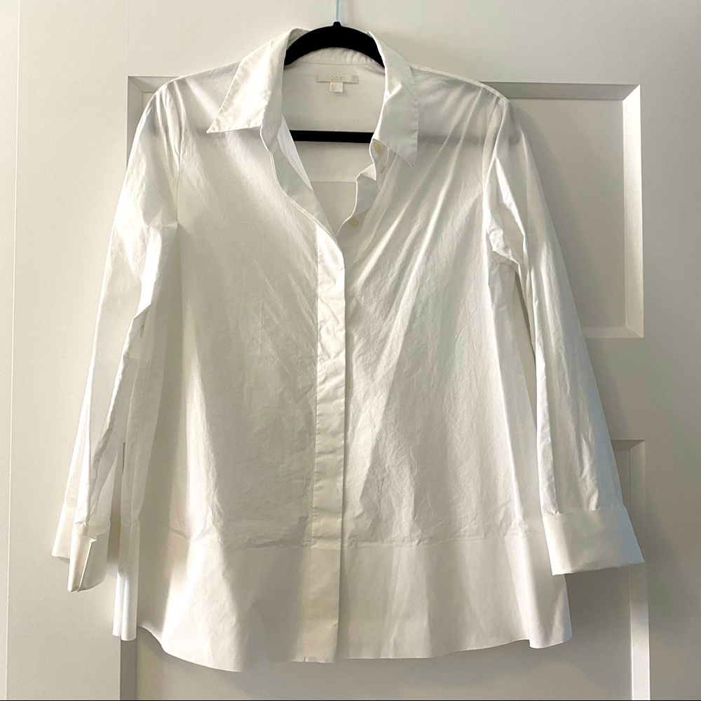COS white button down with stiff hem.